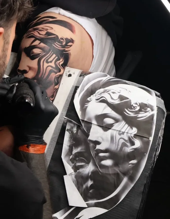 Marble: black and grey tattoo on the shoulder / back
